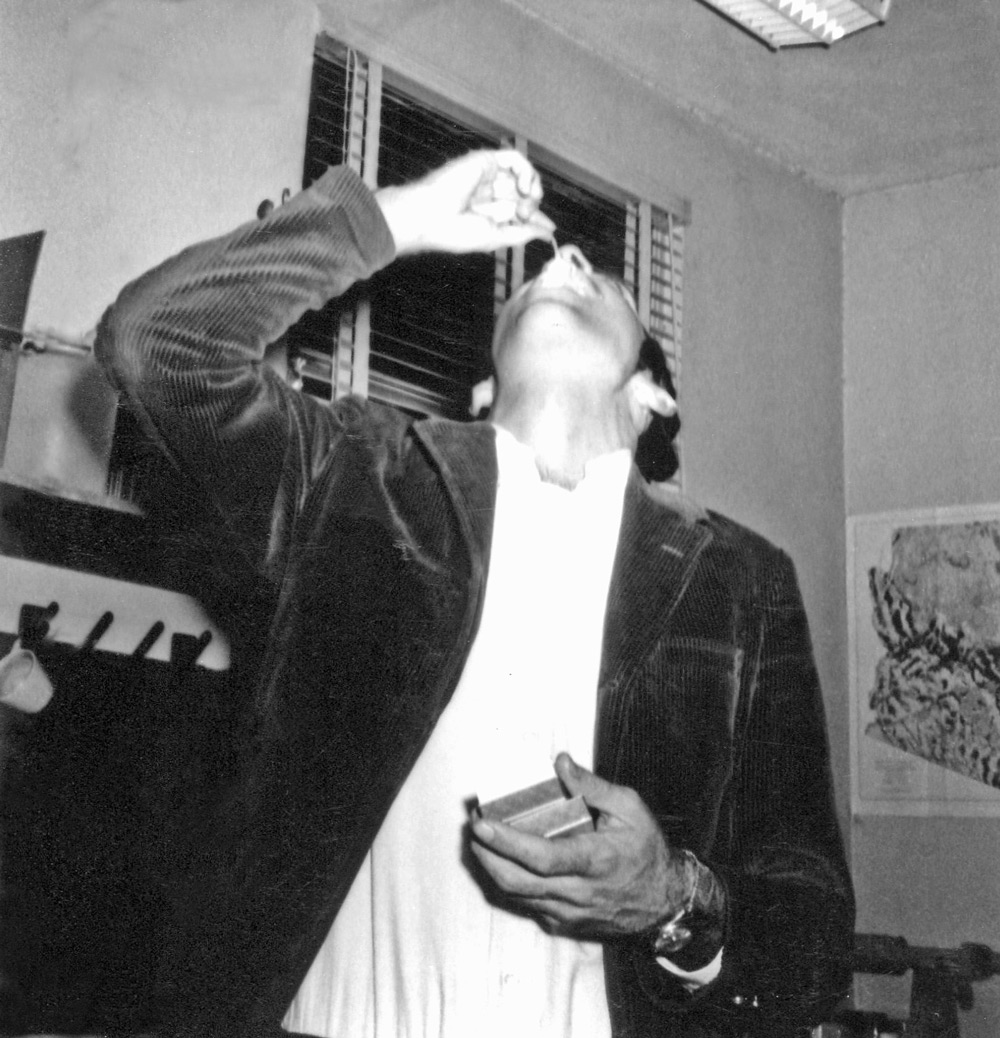 Bob Bezy eating mouse at the Lowe lab, photo by Oscar Soule, 1968.