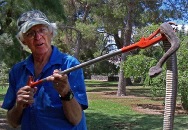 Cecil Schwalbe and an anonymous rattlesnake