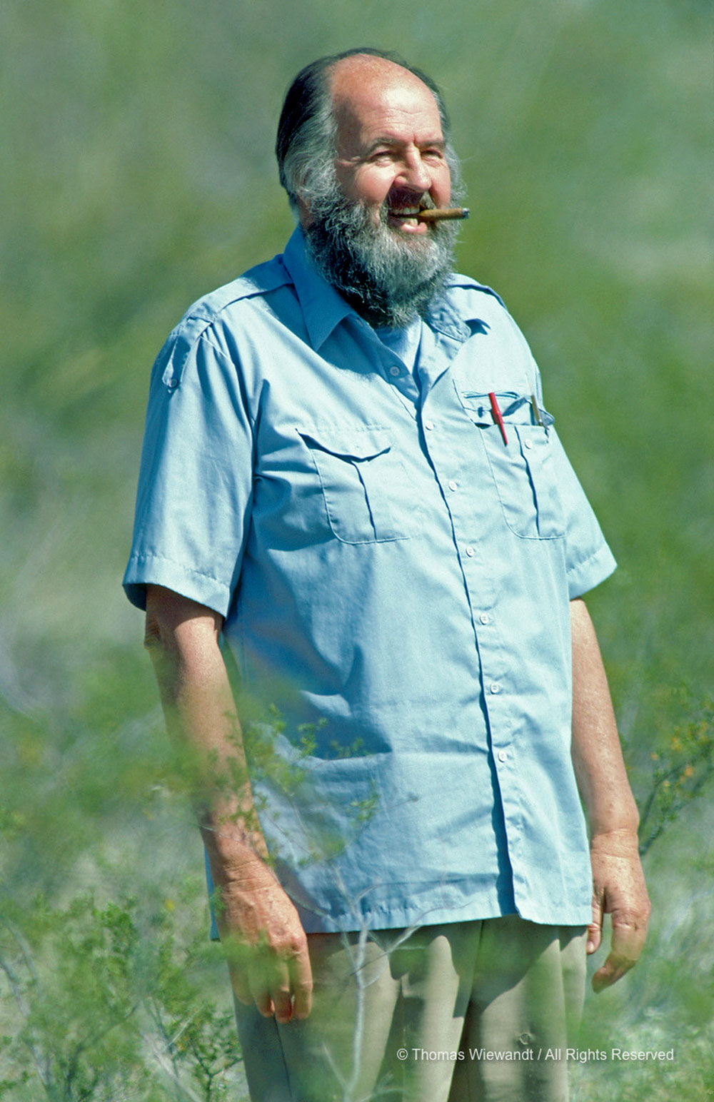 Charles H. Lowe Jr. photographed at Rancho de Las Lomas in Tucson while working with Thomas Wiewandt on a motion picture segment about Gila Monsters for the BBC's THE LIVING PLANET television series, ca. 1983. 